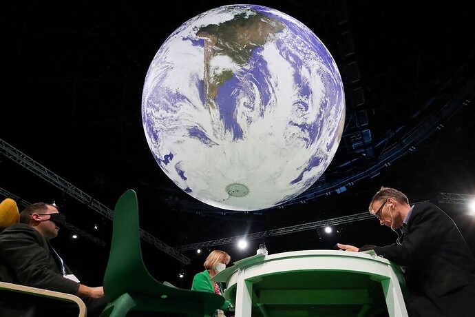 COP26 vật lộn với những vấn đề còn tồn tại, lóe sáng giải pháp đến từ Vương quốc Anh