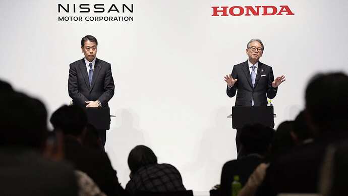 Makoto Uchida, president and CEO of Nissan Motor, and Toshihiro Mibe, Honda Motor president and CEO, attend their joint press conference in Tokyo, Japan March 15, 2024. Mandatory credit Kyodo via REUTERS ATTENTION EDITORS - THIS IMAGE WAS PROVIDED BY A THIRD PARTY. MANDATORY CREDIT. JAPAN OUT. NO COMMERCIAL OR EDITORIAL SALES IN JAPAN