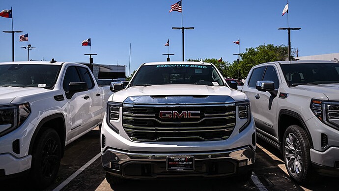 Vehicles are seen for sale at a GMC dealership in Houston, Texas, on April 7, 2025. The US president has said that by imposing tariffs on cars and car parts he wants to bring production back to his country, but economists say high domestic labor costs and other factors will make that challenging. (Photo by RONALDO SCHEMIDT / AFP) (Photo by RONALDO SCHEMIDT/AFP via Getty Images)