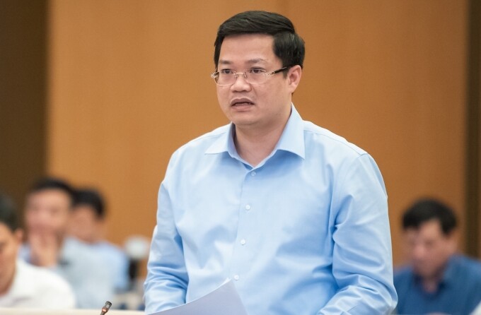 Ông Nguyễn Đức Tâm, Thứ trưởng Tài chính trình bày báo cáo giải trình, tiếp thu dự thảo nghị quyết về kinh tế tư nhân, tối 16/5. Ảnh: Trung tâm báo chí Quốc hội